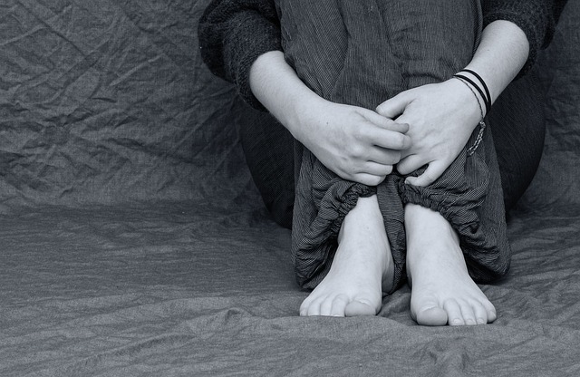 Holding Knees Image