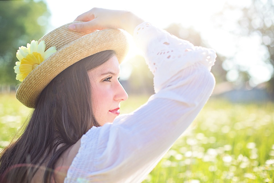 Woman Wearing Hat in a Field Image