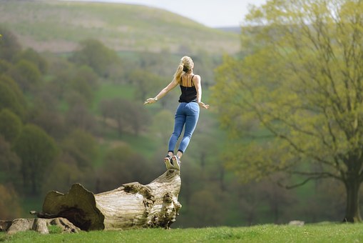 Woman Balancing on a Log Image