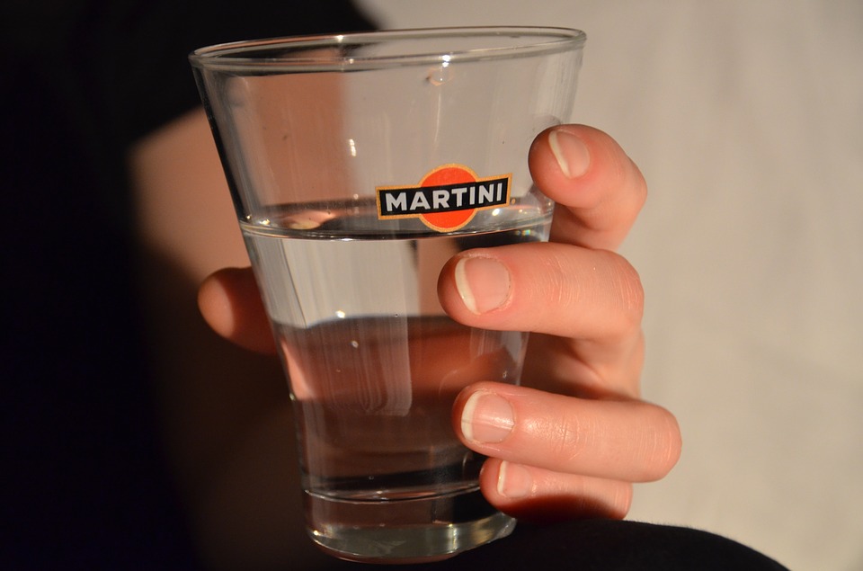 hand holding a liquor glass
