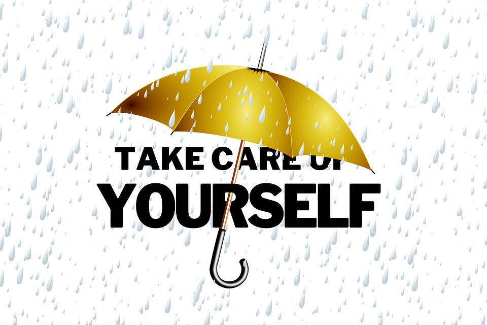 Umbrella over the phrase "Take Care of Yourself" Image