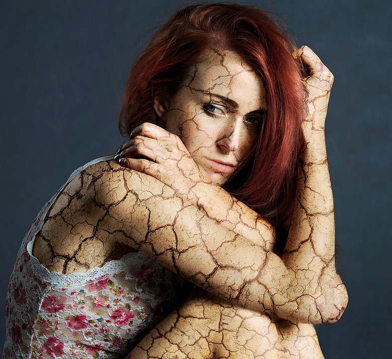 Sad woman with skin cracking image